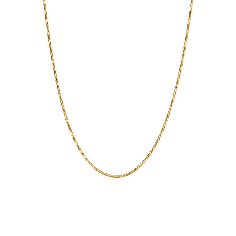 Collar Omega en acero inoxidable color oro, diseño rígido y elegante para diario
