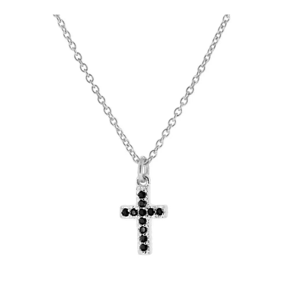Detalle del collar cruz con circonitas negras, pieza fina de inspiración religiosa