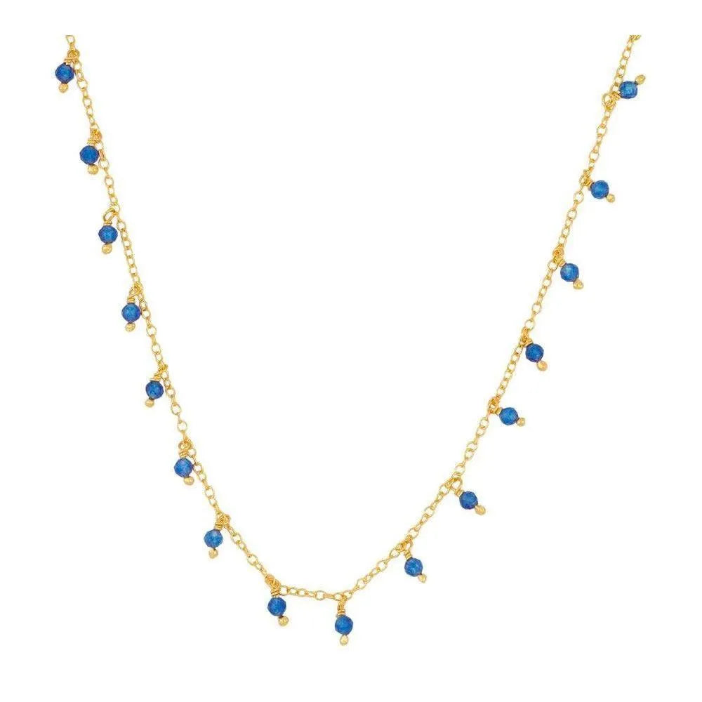 Collar de piedras semipreciosas en tonos azules, vista lateral sobre cuello